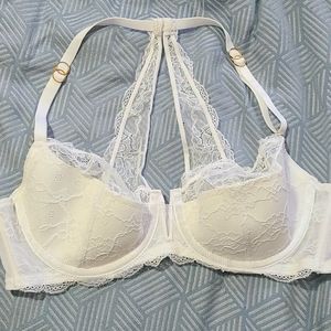 Cacique White lace detail with lace strap back.